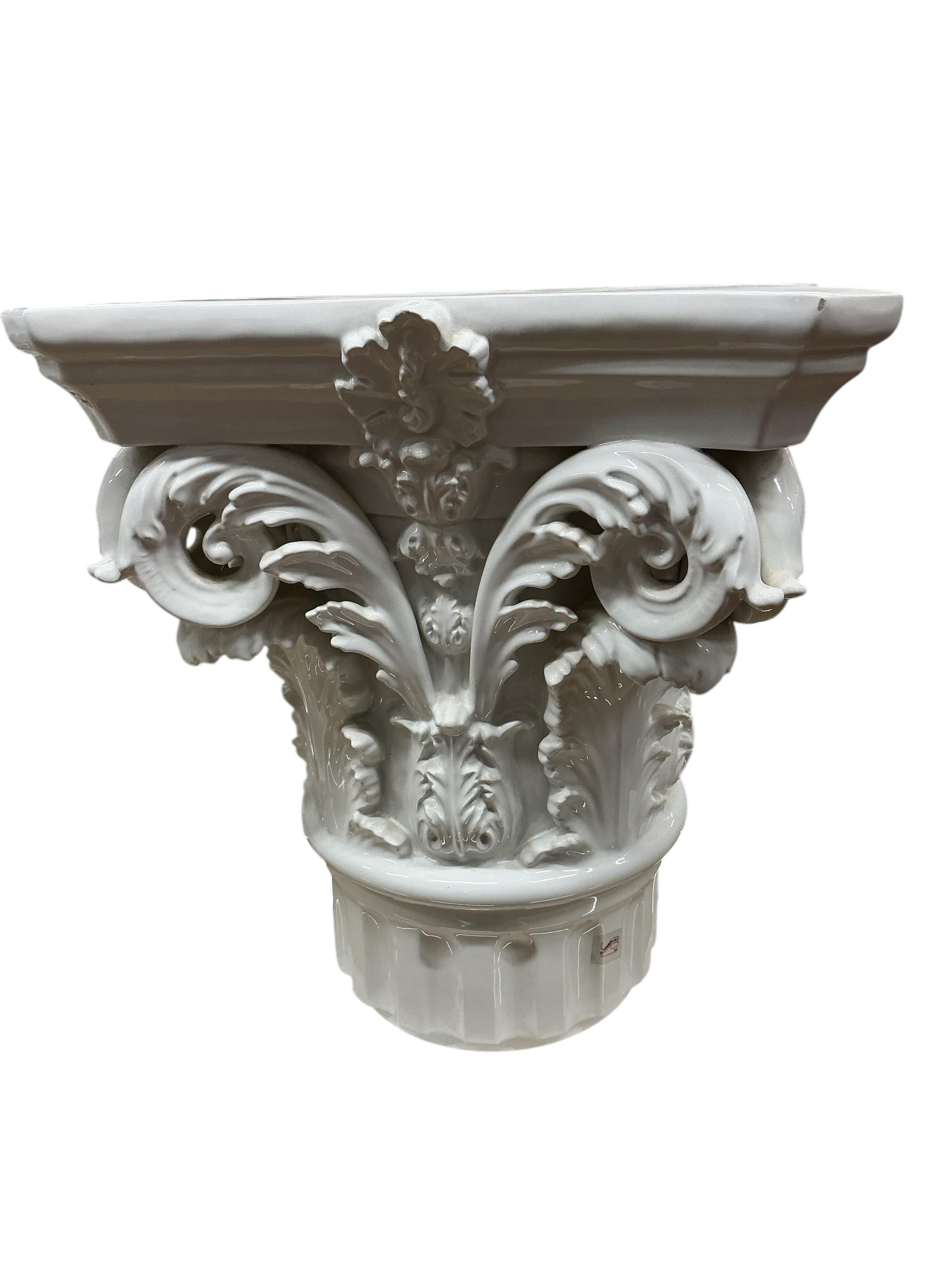 A pair of Italian VBC Ceramica Corinthian column capital pedestals, height 47cm